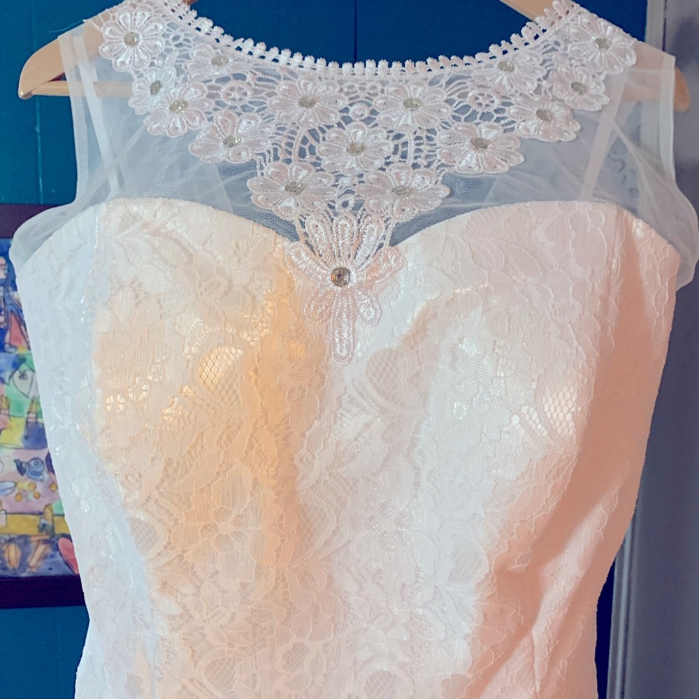 Brand new never worn or altered white lace wedding dress